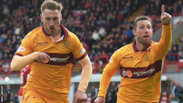 Scott McDonald celebrates with match-winner Louis Moult (left)