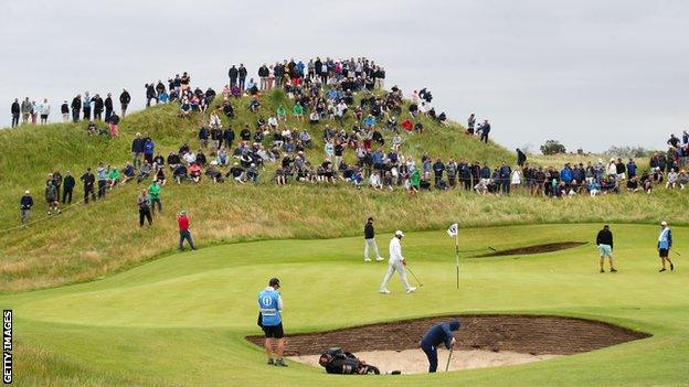 Players practising on the sixth green on Wednesday