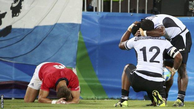 Team GB's Tom Mitchell reacts with despair as Vatemo Ravouvou scores for Fiji