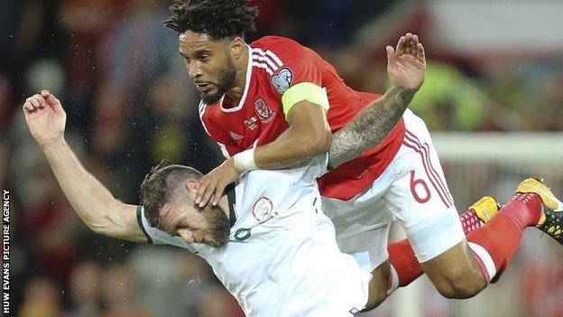 Wales captain Ashley Williams clashes with Daryl Murphy of Republic of Ireland in Cardiff in October 2017