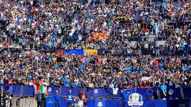 Fans watch Rory McIlroy tee off in the Ryder Cup singles at Le Golf National in Paris