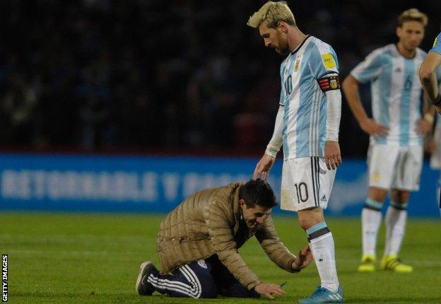 One Argentina fan attempts to kiss Messi's boots