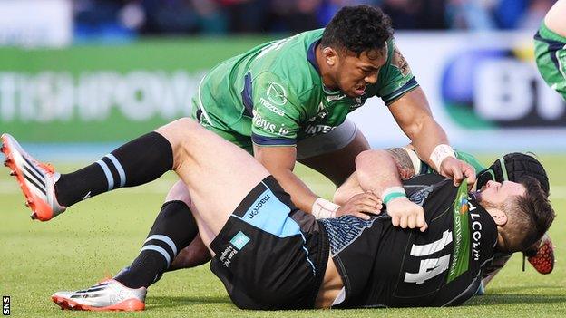 Connacht's Bundee Aki holds down Glasgow wing Sean Lamont