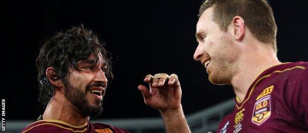 Johnathan Thurston and Michael Morgan