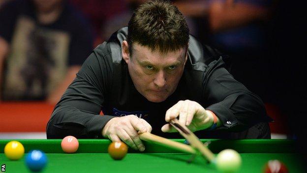 Jimmy White lines up a shot