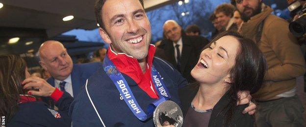 David Murdoch's wife Stephanie greets him as he returns from the Sochi Olympics with a silver medal