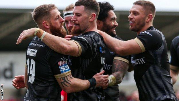 Toronto Wolfpack players celebrate a try