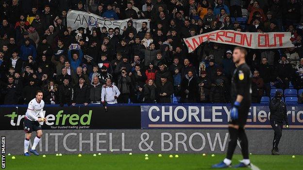 Bolton Wanderers fans protest during the game against West Brom