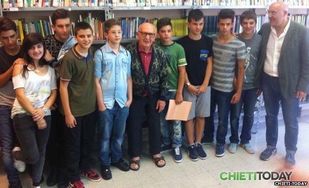 Nicola Torello alongside schoolchildren