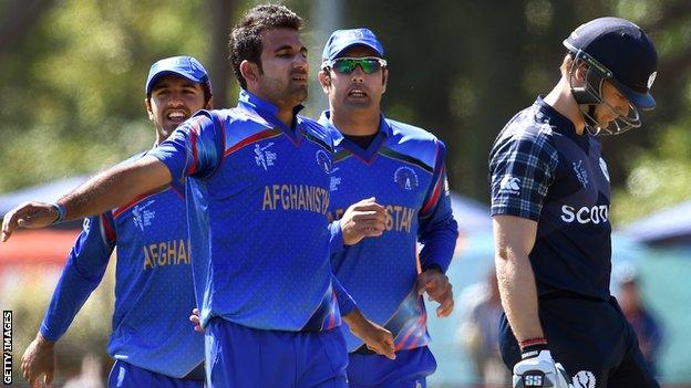 Afghanistan's Dawlat Zadran and Scotland's Richie Berrington