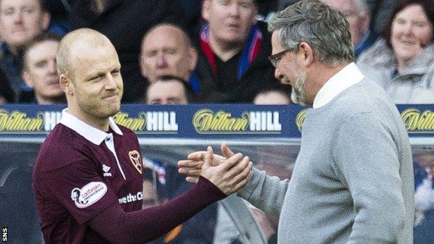 Steven Naismith shakes hands with hearts boss Craig Levein