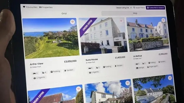 An iPad screen with pictures of houses and house prices on an estate agency website.