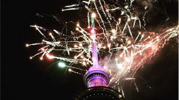 Sky Tower surrounded by a firework display in Auckland, New Zealand