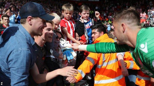 Jack Butland gives gloves to fans