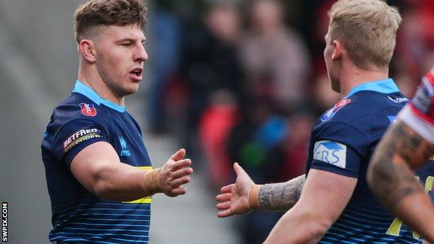 George Williams celebrates a try for Wigan Warriors