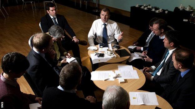 Stewart Regan speaking to journalists