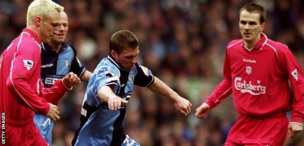 Dannie Bulman (centre) in action for Wycombe Wanderers against Liverpool