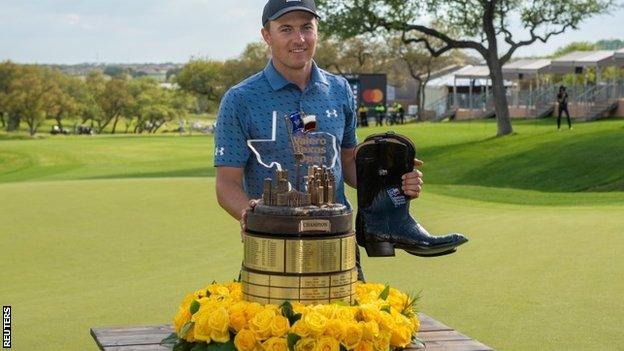 Jordan Spieth with trophy and a pair of boots after winning the Texas Open