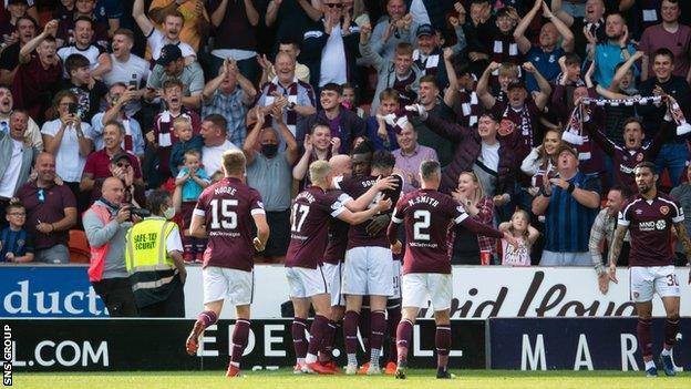 Hearts players celebrate in front of their fans at Tynecastle