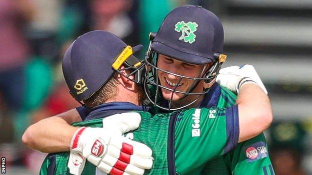 Paul Stirling celebrates his century with Harry Tector in the final ODI against New Zealand