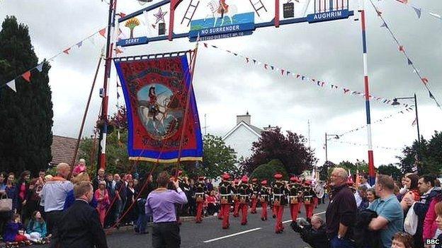 Orangemen parading behind a band