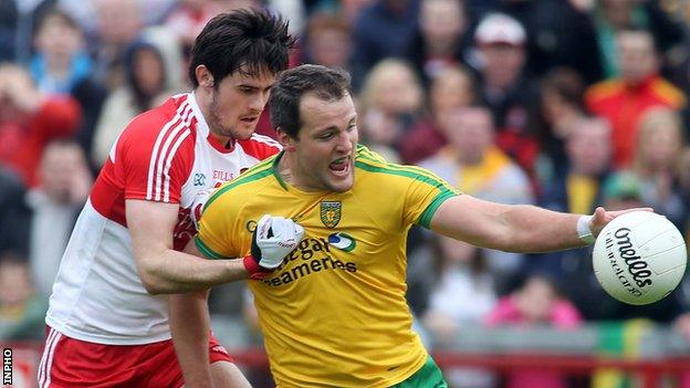 Chrissy McKaigue battles with Donegal's Michael Murphy in the 2014 Ulster SFC tie at Celtic Park