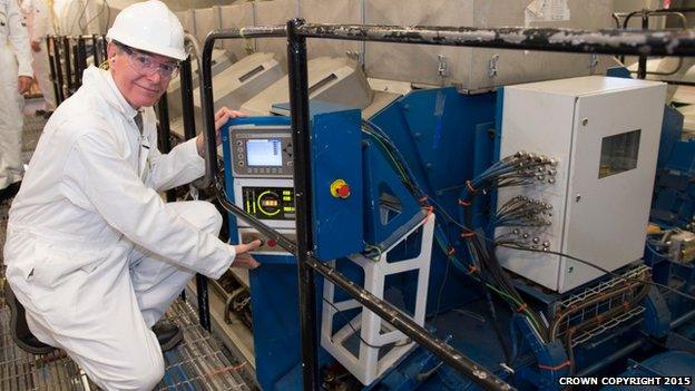 Defence procurement minister Philip Dunne officially starting the first of the ship's four generators