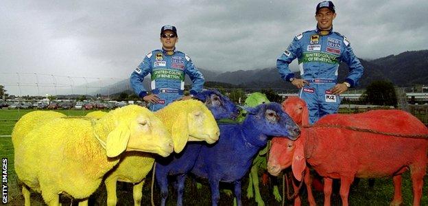 Giancarlo Fisichella and Alexander Wurz of Benetton in a field of sheep during the Austrian GP in 1999