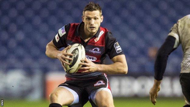 Jason Tovey runs with the ball for Edinburgh