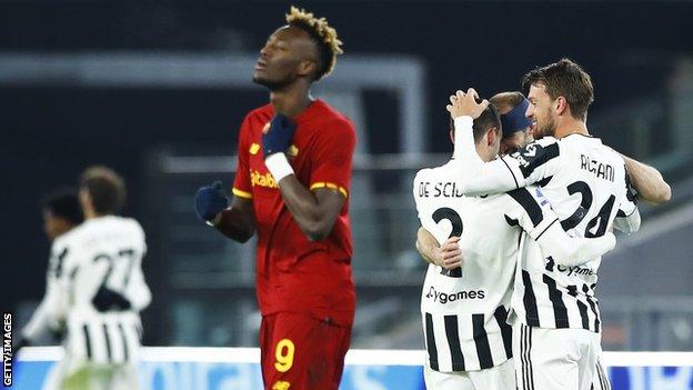 Tammy Abraham looks sad as Juventus players celebrate