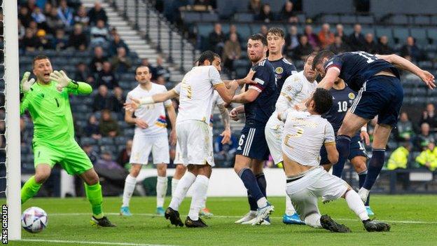 Scott McKenna (right) heads Scotland into a 2-0 lead at home to Armenia