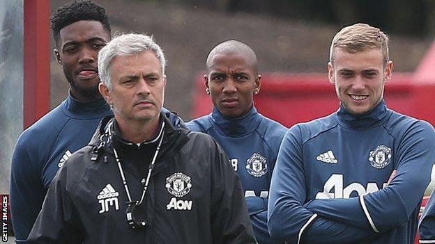 Manchester United 's Jose Mourinho, Luke Young and James Wilson at a training session