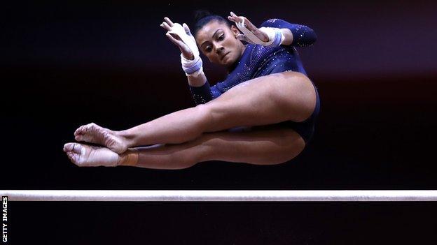 Becky Downie competing on the uneven bars at the World Championships in Doha