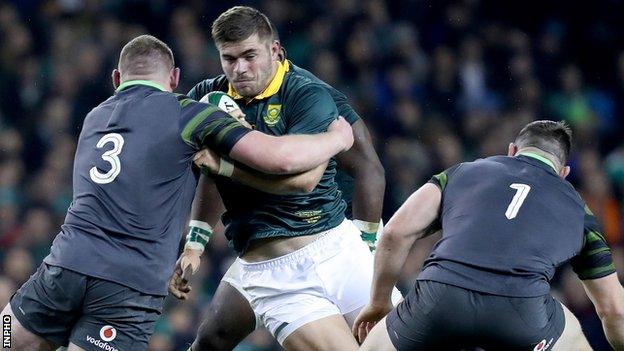 South Africa hooker Malcolm Marx is tackled by Ireland prop Tadhg Furlong