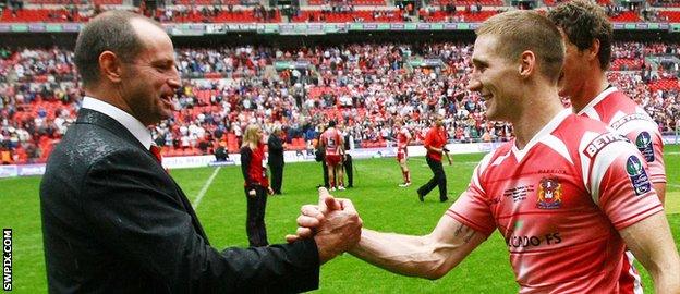 Michael Maguire celebrates with Sam Tomkins