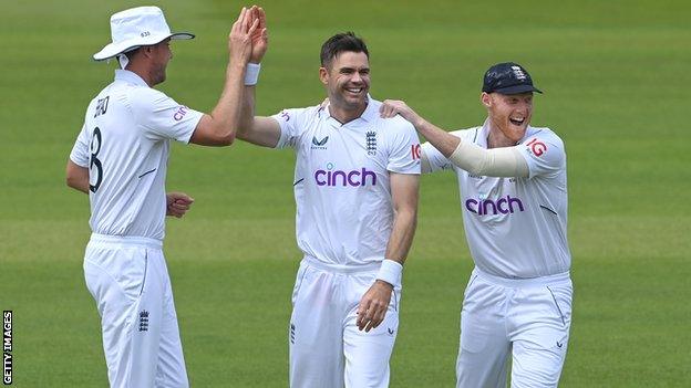 James Anderson celebrating a wicket with Stuart Broad and Ben Stokes