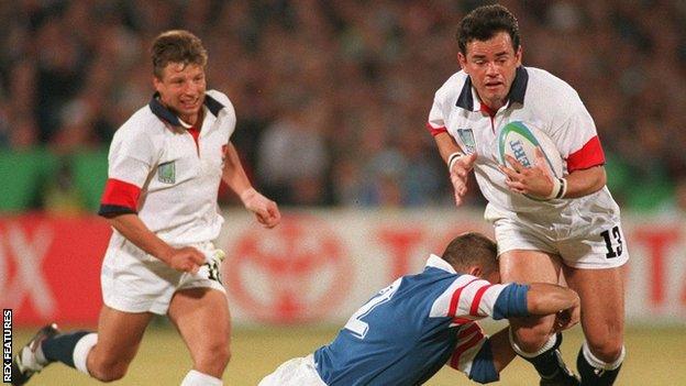 Rob Andrew and Will Carling in action against France