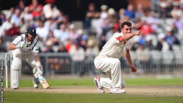 Ryan McLaren's removal of Warwickshire's Ian Bell was the home side's big breakthrough at Old Trafford