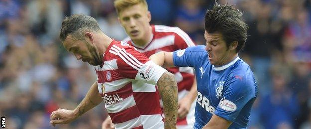 Joey Barton tussles for possession with Hamilton's Dougie Imrie