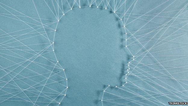 Artistic impression of a mind sewn onto a blue canvas