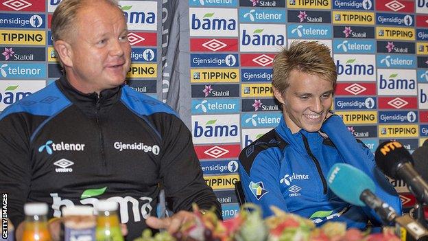 Martin Odegaard and Norway head coach Per Mathias Hoegmo speak at a press conference in 2014 shortly before the then 15-year-old's international debut