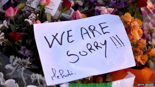 Flowers and tributes are left at Marhaba beach near to where 38 people were killed on Friday in a terrorist attack