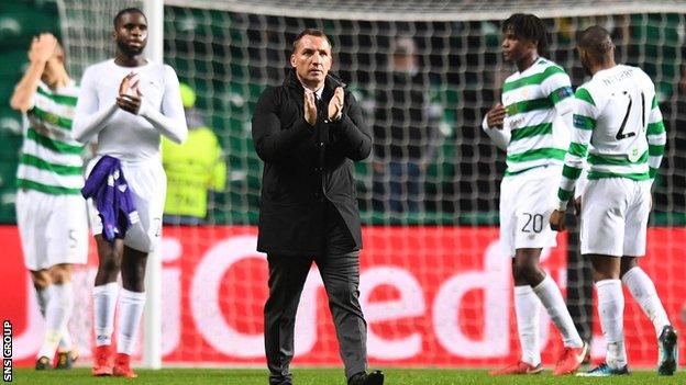 Celtic manager Brendan Rodgers applauds fans at full-time