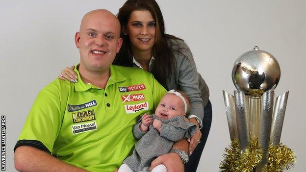 Michael van Gerwen with wife Daphne, daughter Zoe and the PDC World Championship trophy