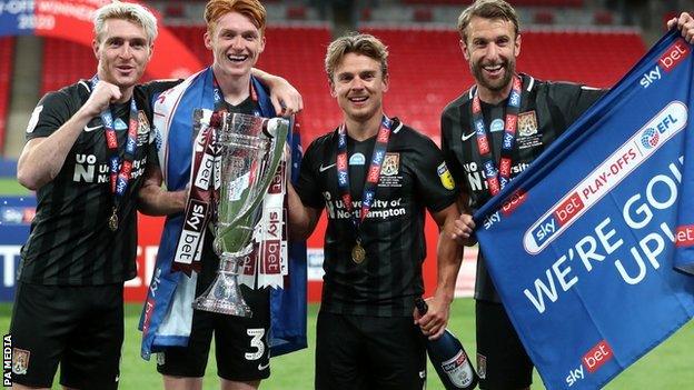 Sam Hoskins (second right) was part of the Cobblers' promotion-winning team of 2020