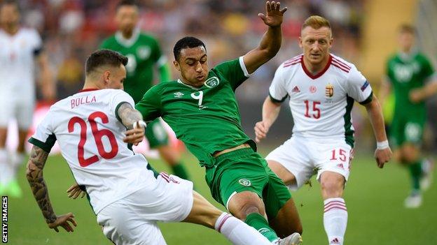 Adam Idah is challenged by Hungary's Bendeguz Bolla in Tuesday's friendly in Budapest