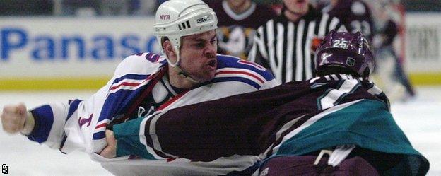 New York Rangers' Dale Purinton and Anaheim Mighty Ducks' Kevin Sawyer fight during an NHL game