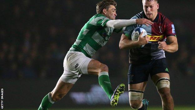 Alex Dombrandt of Harlequins is tackled by Toby Flood of Newcastle