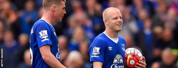 Steven Naismith (right) trots off with the match ball against Chelsea