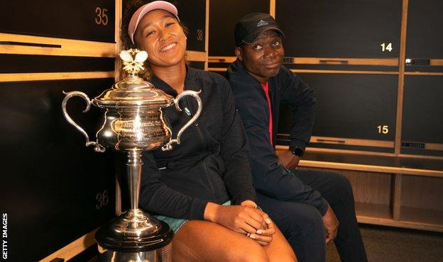 Naomi Osaka pictured with her dad and the Australian Open trophy